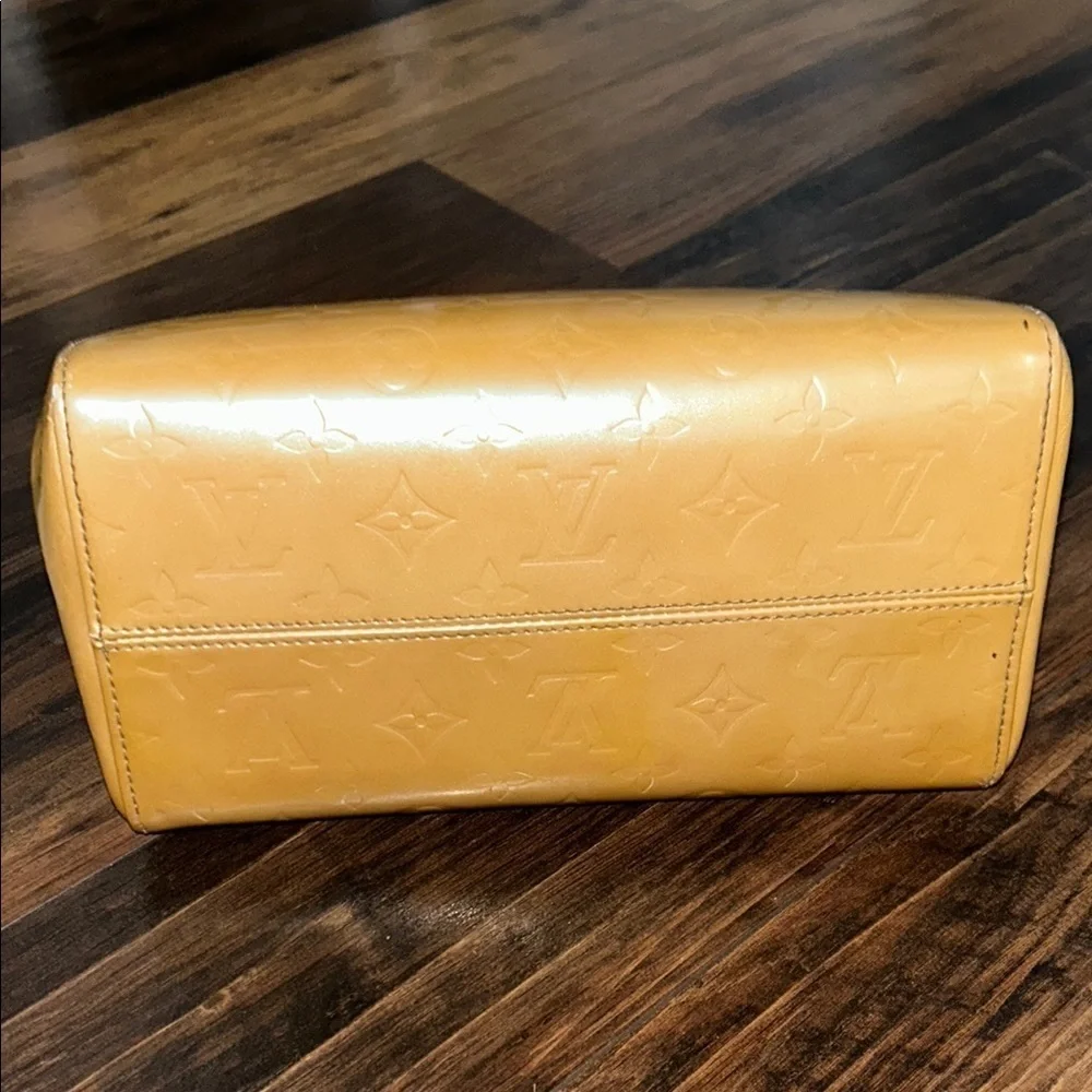 LOUIS VUITTON Gold Tote with Iconic Embossed Design